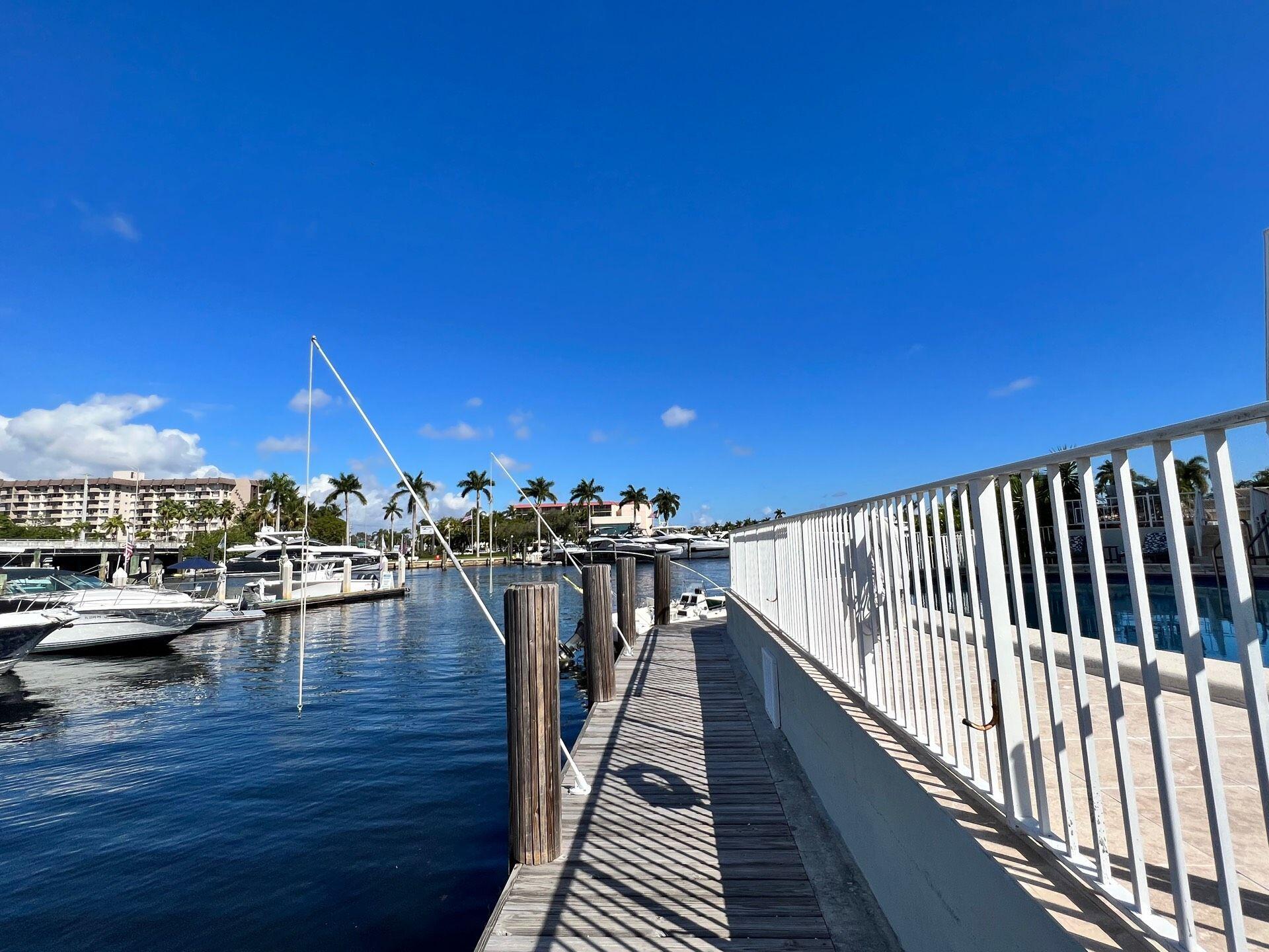 811 Southeast 22nd Avenue, Unit 12 Pompano Beach, FL 33062 - Photo 13 of 25 a view of a balcony with dining table and chairs