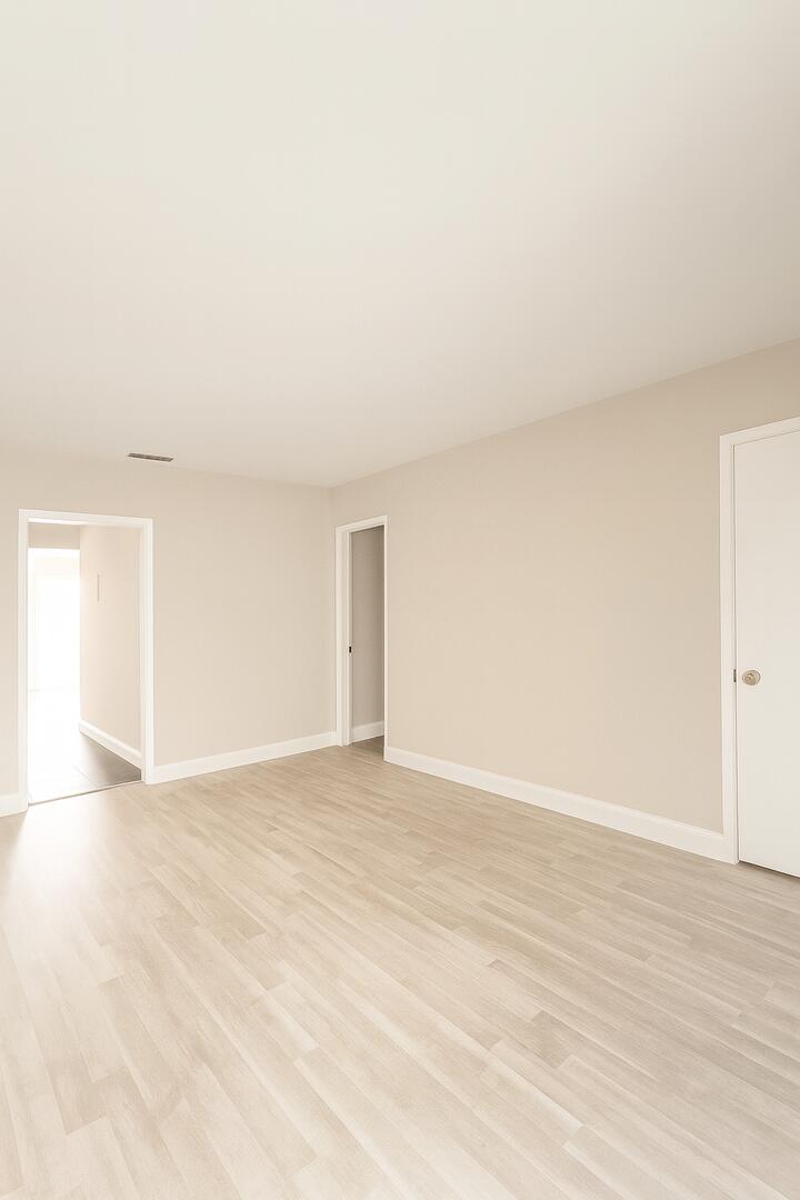 811 Southeast 22nd Avenue, Unit 12 Pompano Beach, FL 33062 - Photo 8 of 25 a view of an empty room and wooden floor