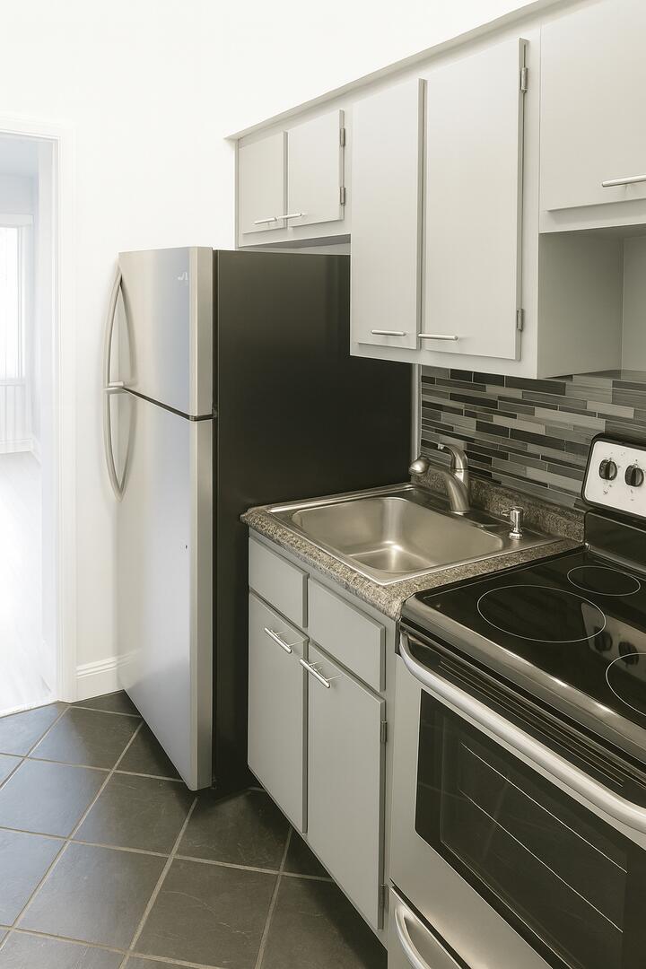 811 Southeast 22nd Avenue, Unit 12 Pompano Beach, FL 33062 - Photo 10 of 25 a close view of a stove top oven and cabinets