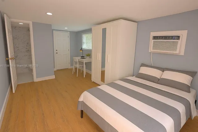 a bedroom with a bed and a table