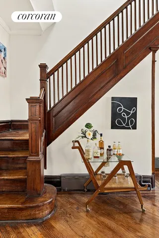 a kitchen with a sink refrigerator and cabinets