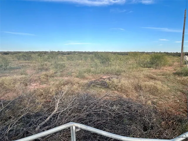 a view of mountain view with tree in background