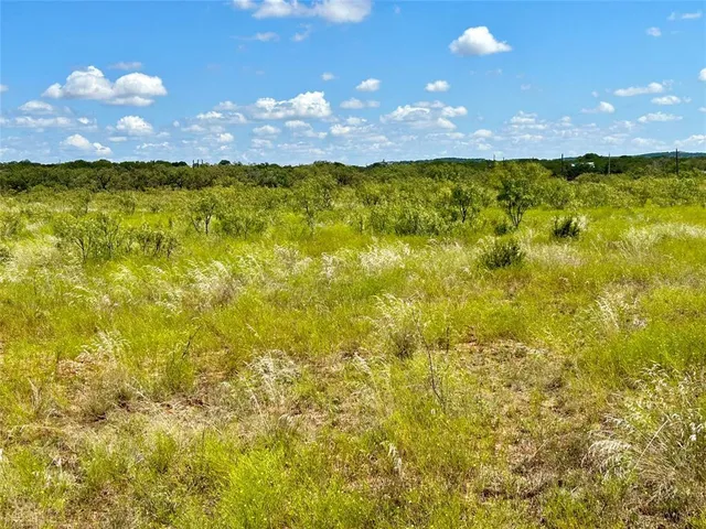 a view of an ocean pool and outdoor seating
