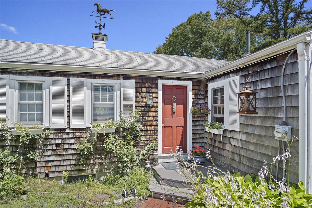 2 Highfield Road Newbury, MA 01951 - Photo 1 of 36 a front view of a house with a yard