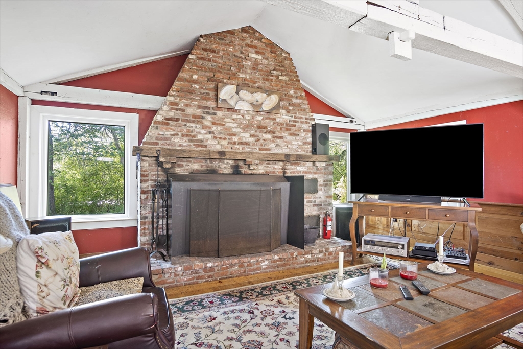2 Highfield Road Newbury, MA 01951 - Photo 21 of 36 a living room with fireplace furniture and a flat screen tv