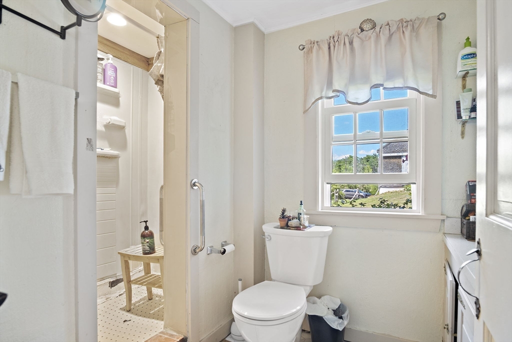 2 Highfield Road Newbury, MA 01951 - Photo 28 of 36 a white toilet sitting next to a bathroom sink and a shower