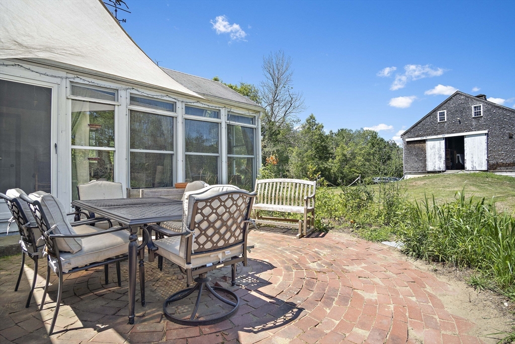 2 Highfield Road Newbury, MA 01951 - Photo 30 of 36 a view of a patio with table and chairs and potted plants