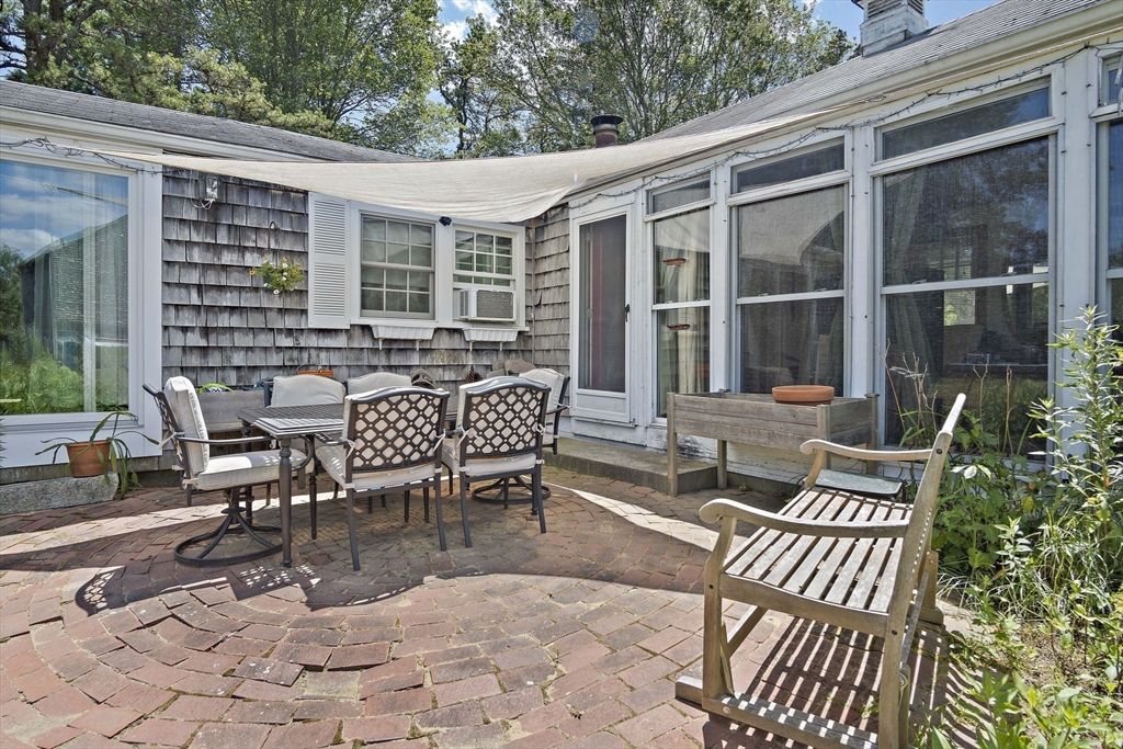 2 Highfield Road Newbury, MA 01951 - Photo 34 of 36 a view of a patio with a dining table and chairs
