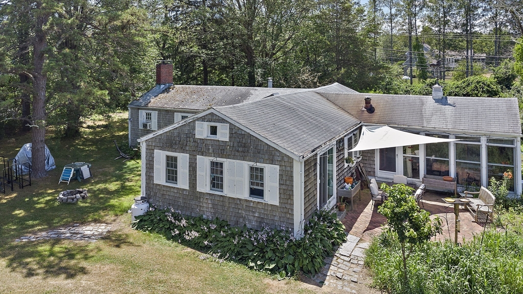 2 Highfield Road Newbury, MA 01951 - Photo 5 of 36 an aerial view of a house with a yard and potted plants