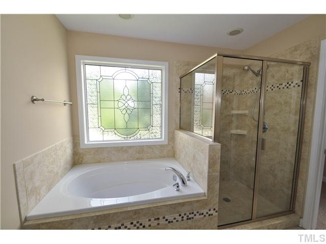 736 Bennett Ridge Court Wake Forest, NC 27587 - Photo 13 of 19 Beautiful master bath with large dual vanity, oversized garden tub, and wonderful glass shower