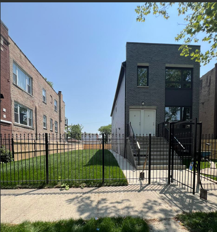 1051 North Springfield Avenue Chicago, IL 60651 - Photo 3 of 50 a view of a street in front of a building