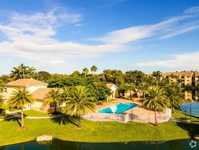 an aerial view of residential houses with swimming pool
