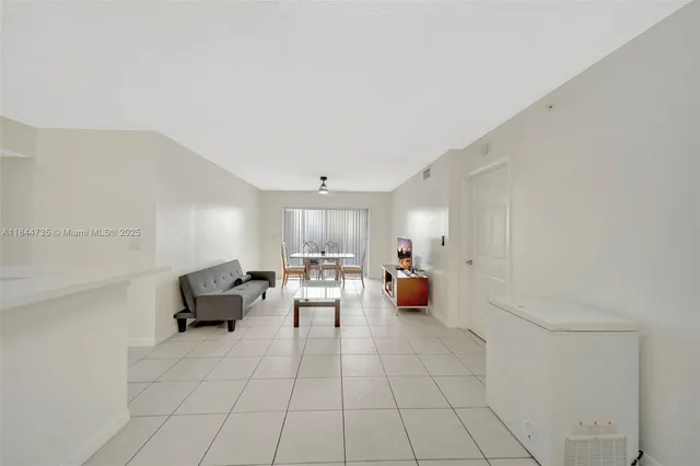 a living room with furniture and fireplace