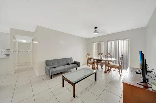 a living room with furniture and a table