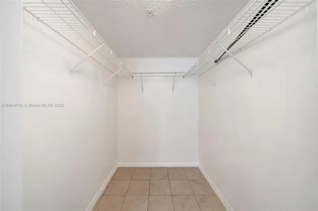 a view of an empty walk in closet
