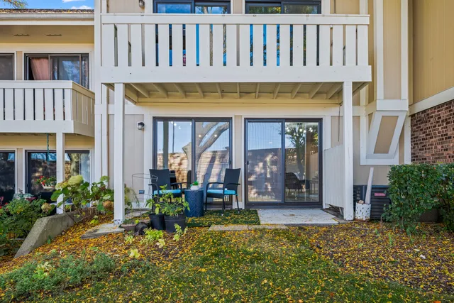 a view of a house with porch and furniture