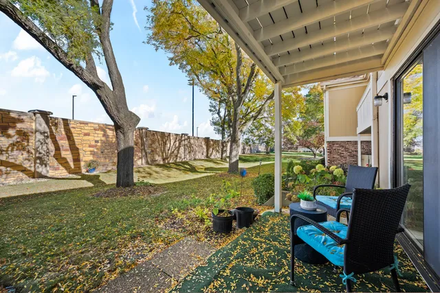 a garden view with a seating space