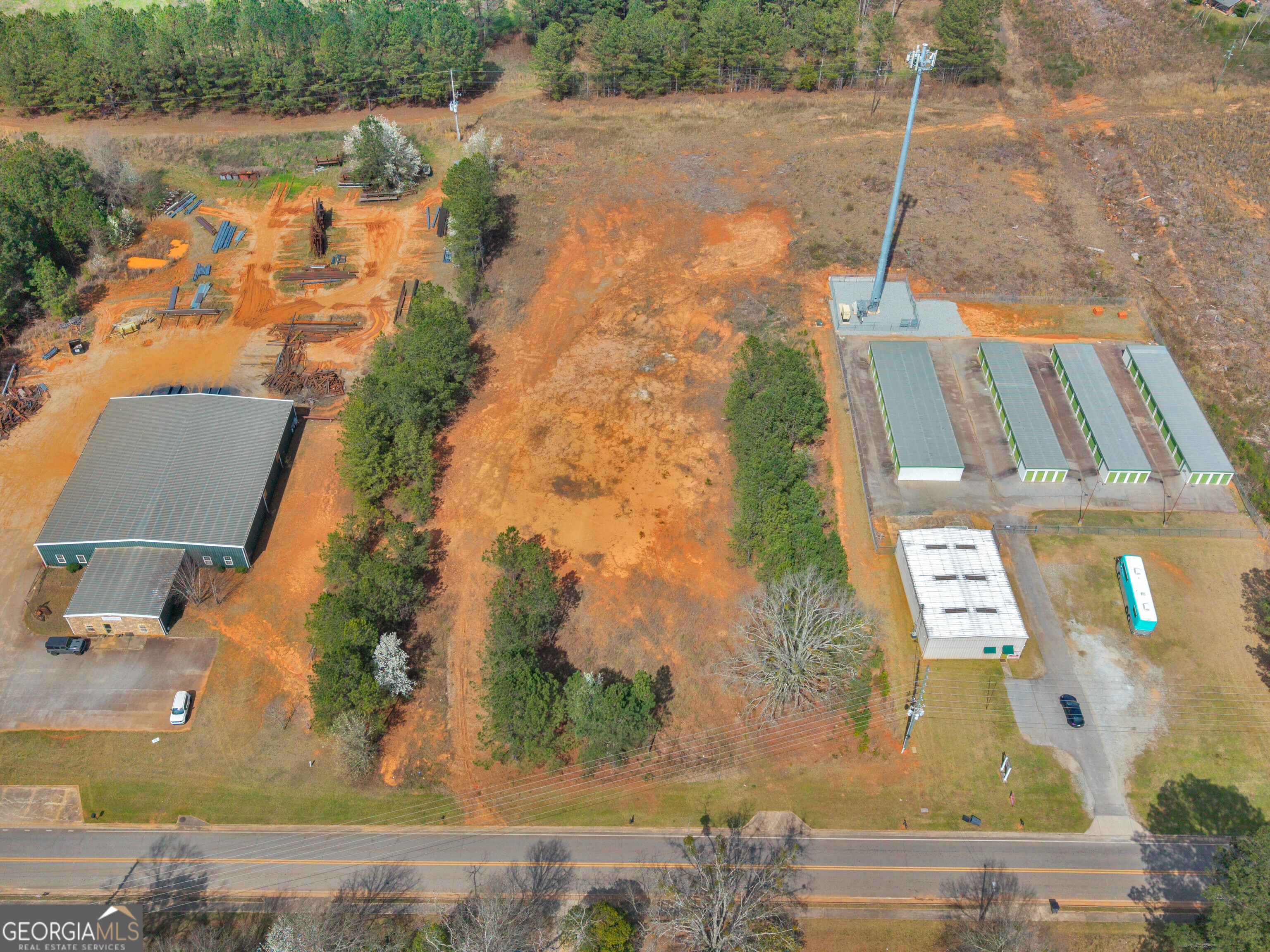 0 County Farm Road Williamson, GA 30292 - Photo 7 of 9 an aerial view of a house with a lake view