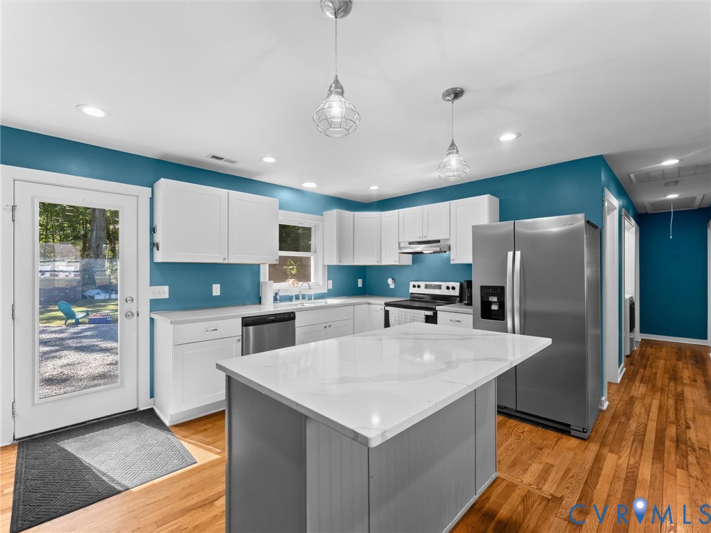 408 Howerton Road Tappahannock, VA 22560 - Photo 12 of 49 Kitchen featuring an island with a light-toned cou