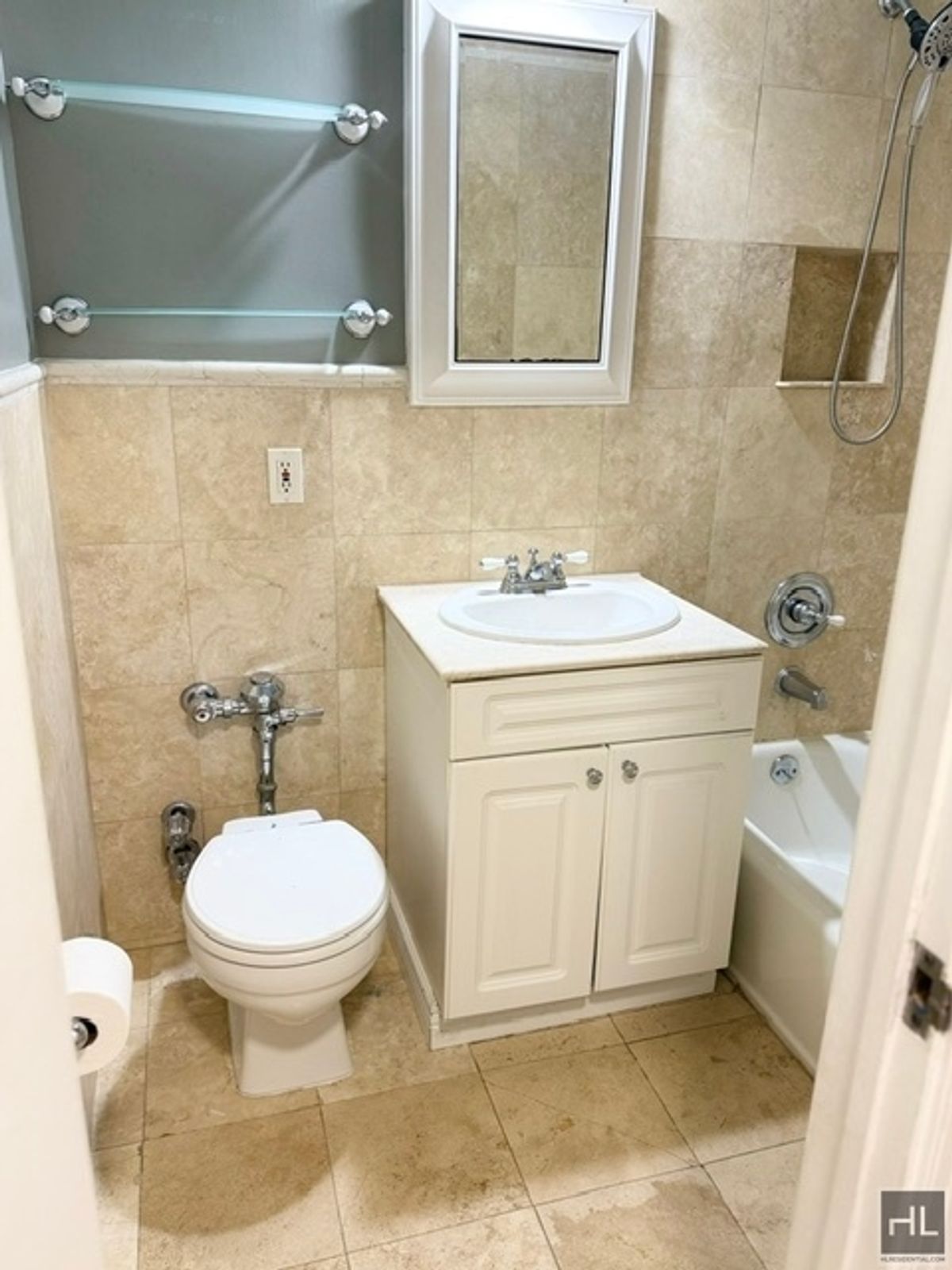 333 East 34th Street, Unit 9O Manhattan, NY 10016 - Photo 5 of 8 a bathroom with a sink toilet and a mirror