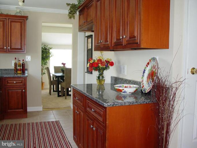 7 Belfast Road Lutherville-Timonium, MD 21093 - Photo 5 of 27 Ceramic flooring, cherry cabinets. Yum!
