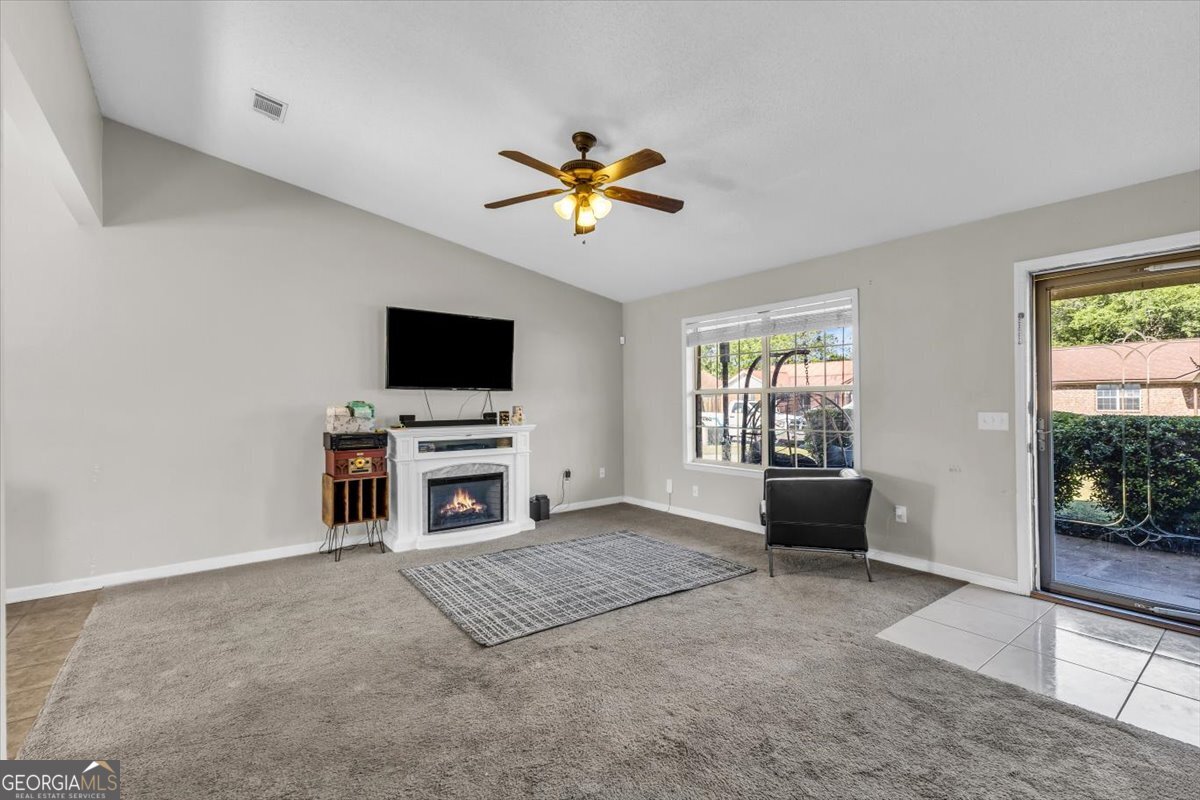 1244 Chinook Way Hinesville, GA 31313 - Photo 9 of 27 a view of a livingroom with furniture and a flat screen tv