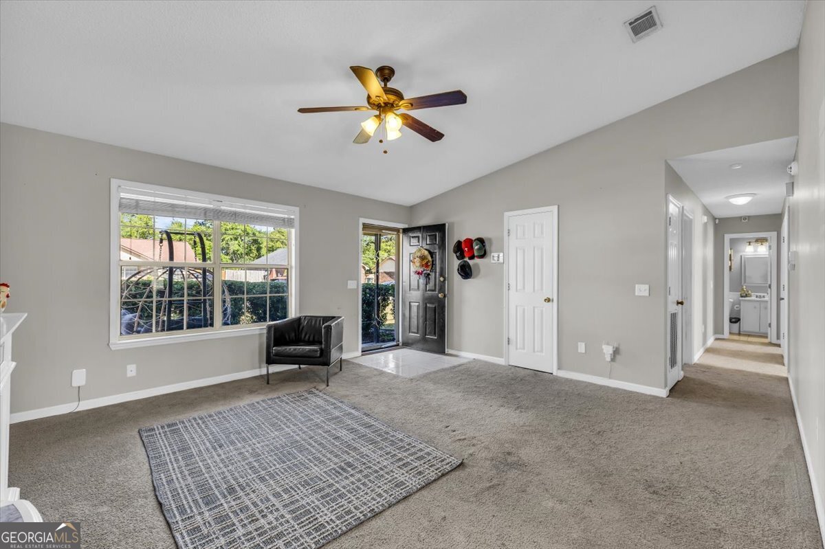 1244 Chinook Way Hinesville, GA 31313 - Photo 10 of 27 a living room with furniture and a window