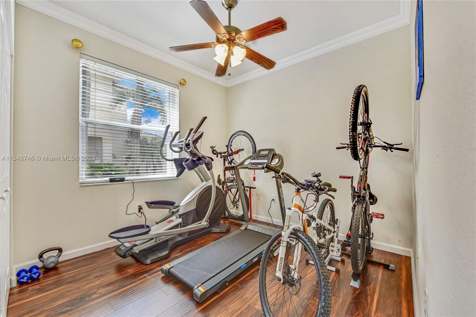 16392 Southwest 29th Street Miramar, FL 33027 - Photo 17 of 30 a view of a room with gym equipment