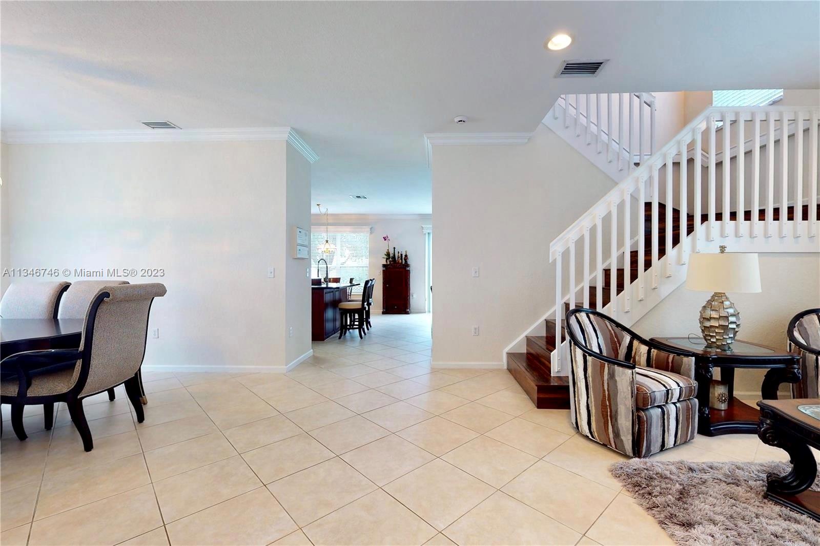 16392 Southwest 29th Street Miramar, FL 33027 - Photo 18 of 30 a view of livingroom with furniture and workspace