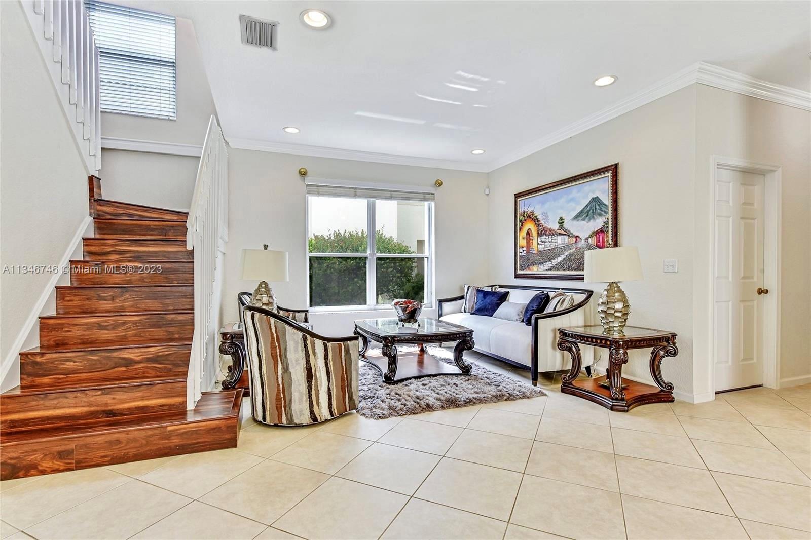 16392 Southwest 29th Street Miramar, FL 33027 - Photo 20 of 30 a living room with furniture