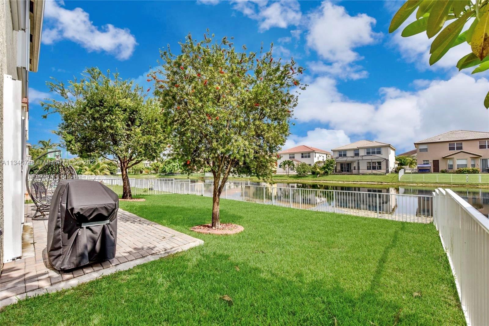 16392 Southwest 29th Street Miramar, FL 33027 - Photo 24 of 30 a view of a garden with a slide