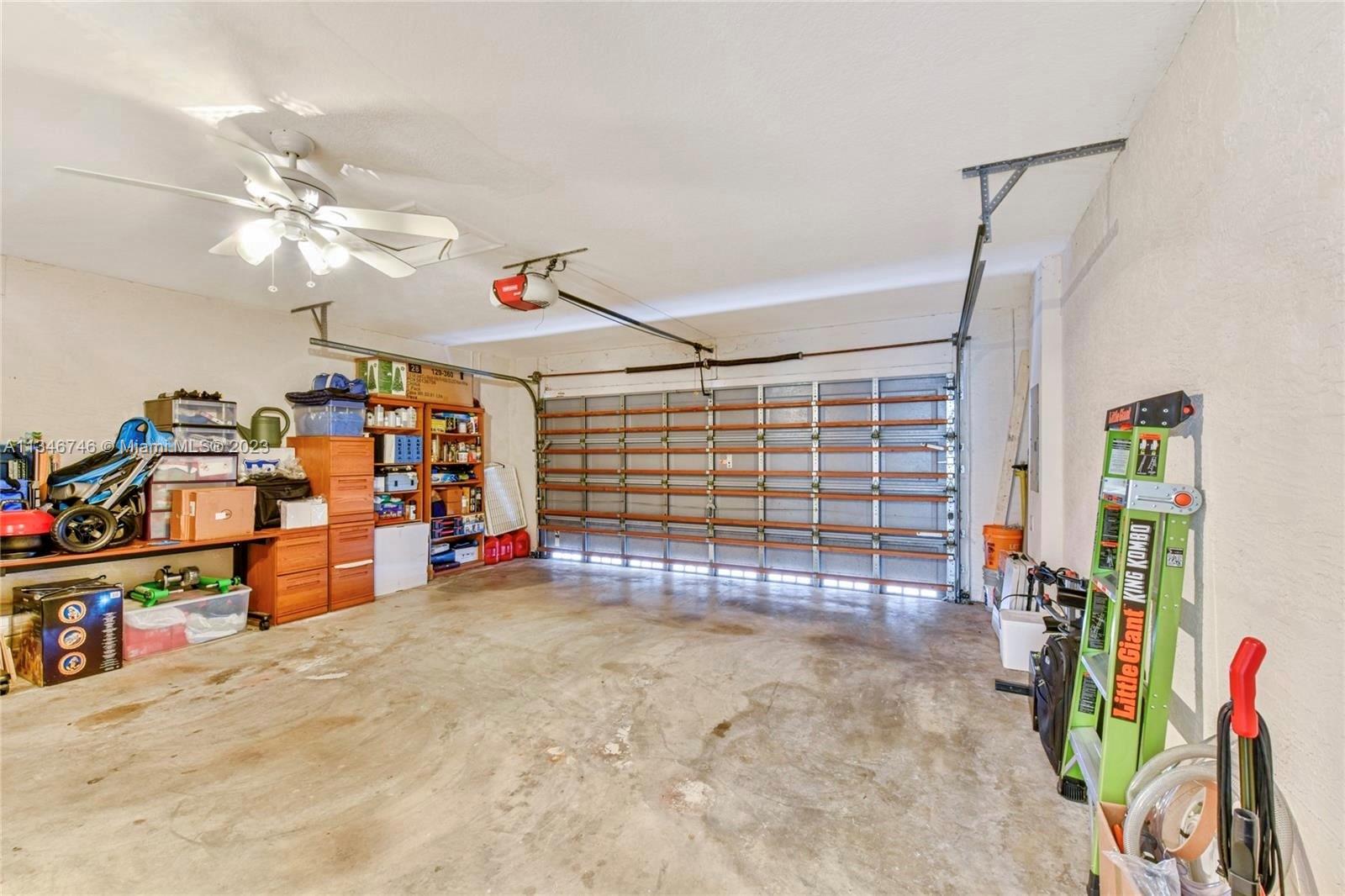 16392 Southwest 29th Street Miramar, FL 33027 - Photo 27 of 30 a view of a garage with rack and bicycle