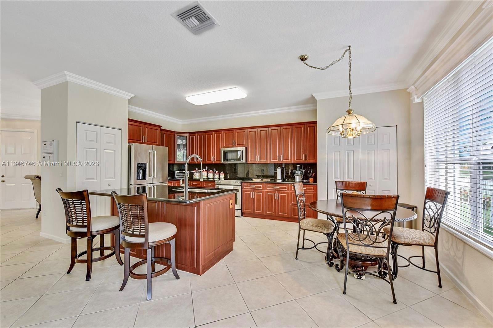 16392 Southwest 29th Street Miramar, FL 33027 - Photo 3 of 30 a view of a dining room with furniture