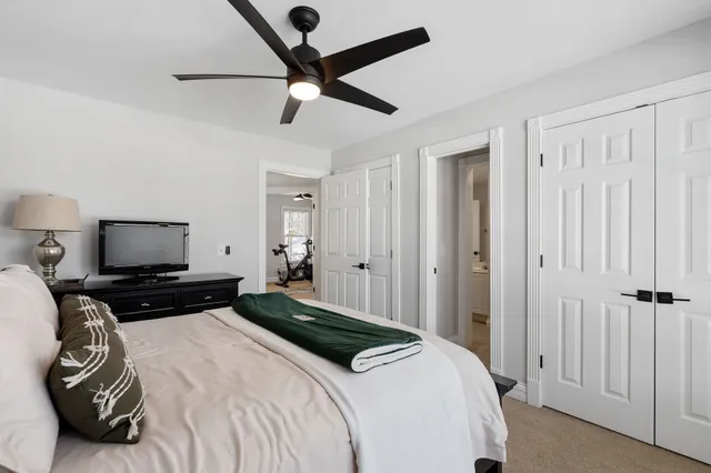 a bedroom with a bed and a tv