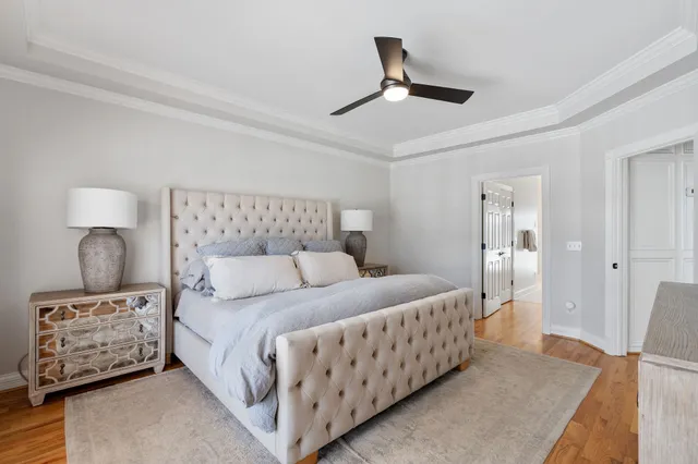 a bedroom with a bed and a night stand