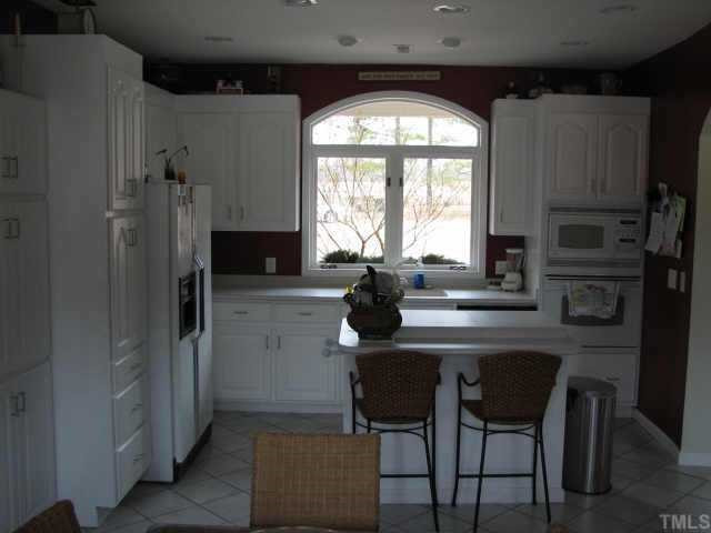 794 New Creech Road Selma, NC 27576 - Photo 5 of 10 A very functional kitchen, new cabinets, solid surface counters,Island & great view. Other