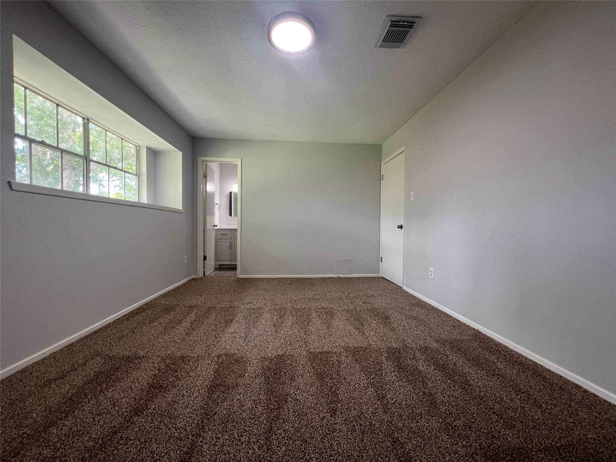 7012 Jetty Lane Houston, TX 77072 - Photo 18 of 24 an empty room with windows