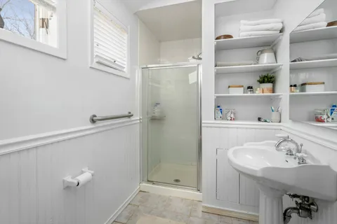 a bathroom with a sink and a shower