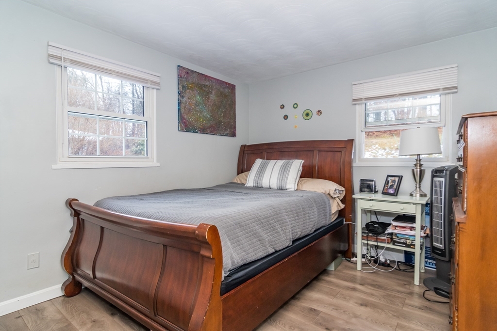 17 Francine Road Framingham, MA 01701 - Photo 10 of 14 a bed sitting in a bedroom next to a window