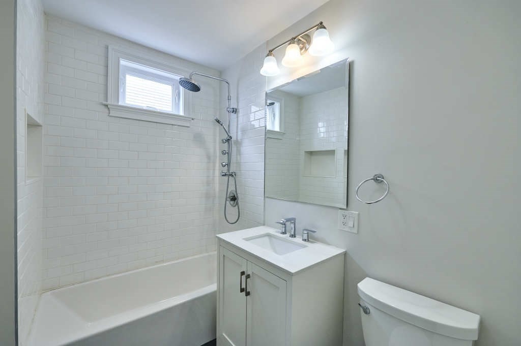 63 Bradford Road, Unit B Watertown, MA 02472 - Photo 12 of 24 a bathroom with a sink toilet and shower