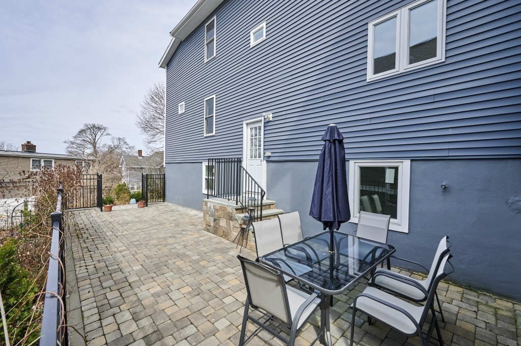 63 Bradford Road, Unit B Watertown, MA 02472 - Photo 22 of 24 a view of a house with backyard and sitting area