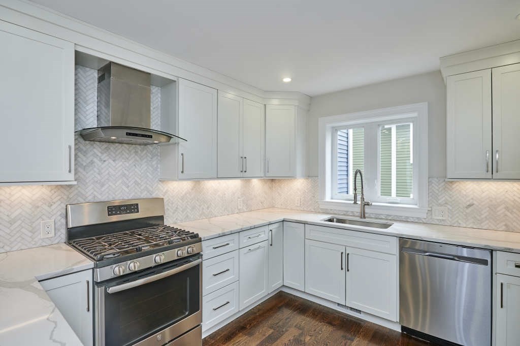 63 Bradford Road, Unit B Watertown, MA 02472 - Photo 6 of 24 a kitchen with a stove oven and sink