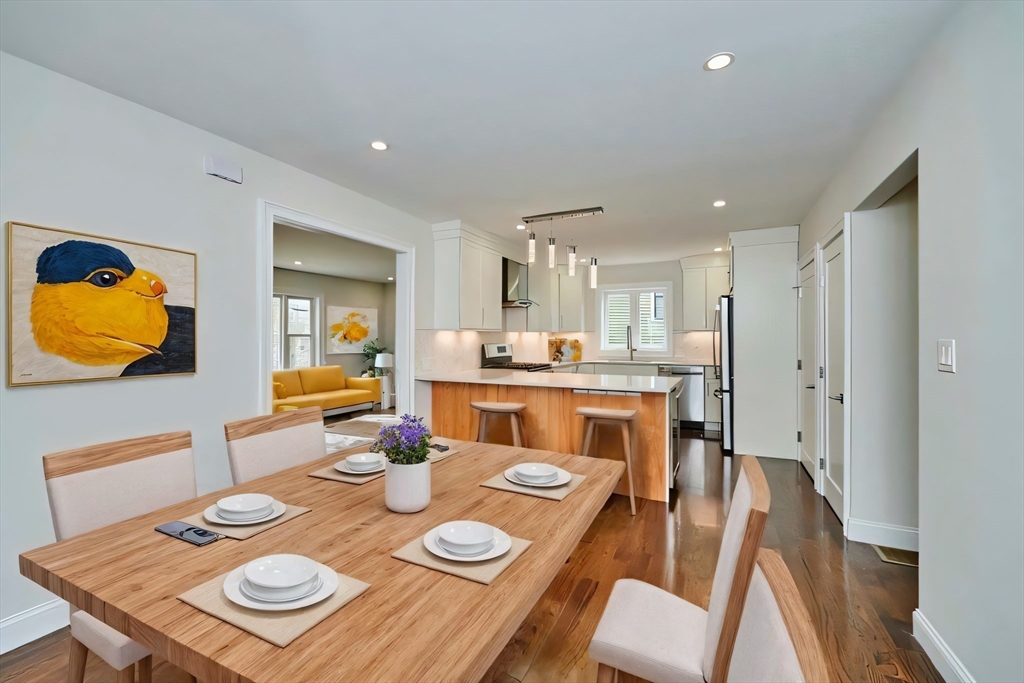 63 Bradford Road, Unit B Watertown, MA 02472 - Photo 7 of 24 a open dining room with furniture and wooden floor