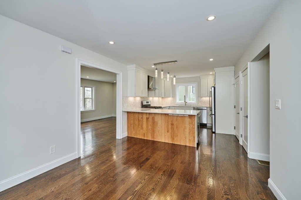 63 Bradford Road, Unit B Watertown, MA 02472 - Photo 8 of 24 a view of kitchen with wooden floor