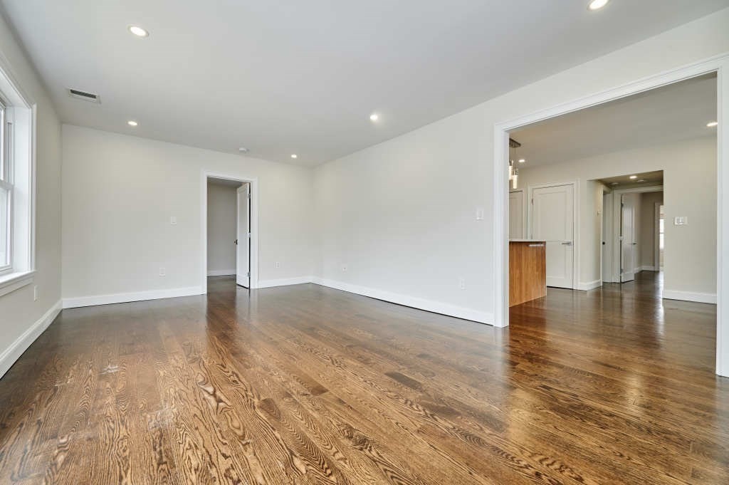 63 Bradford Road, Unit B Watertown, MA 02472 - Photo 10 of 24 a view of a livingroom with wooden floor