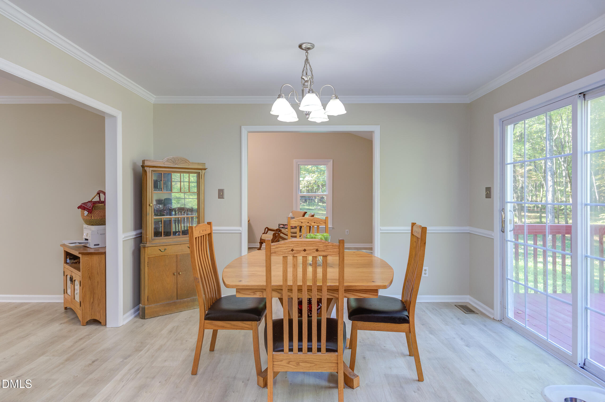 2120 New Sharon Church Road Hillsborough, NC 27278 - Photo 17 of 51 a view of a dining room with furniture and wooden floor
