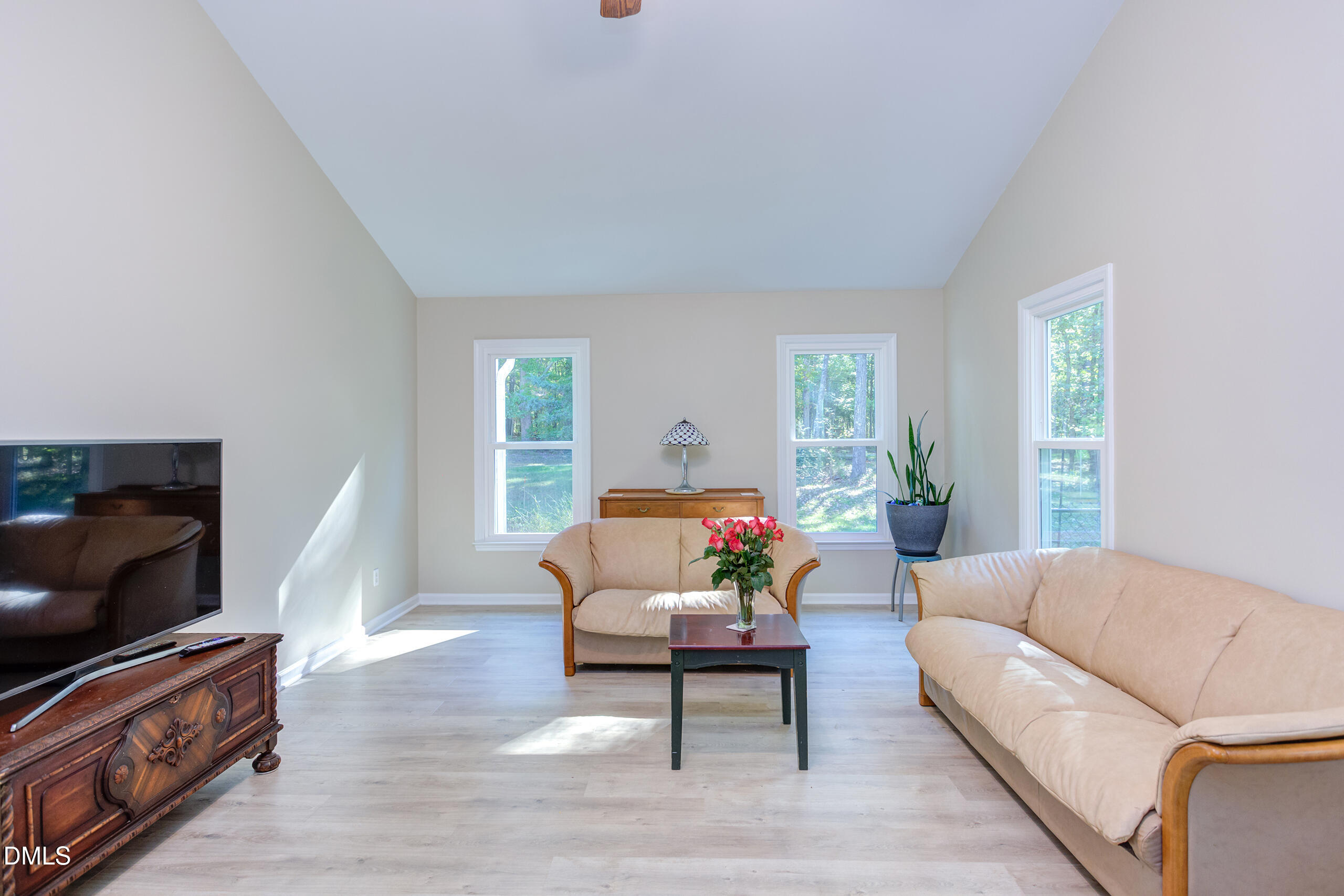 2120 New Sharon Church Road Hillsborough, NC 27278 - Photo 20 of 51 a living room with furniture and a flat screen tv
