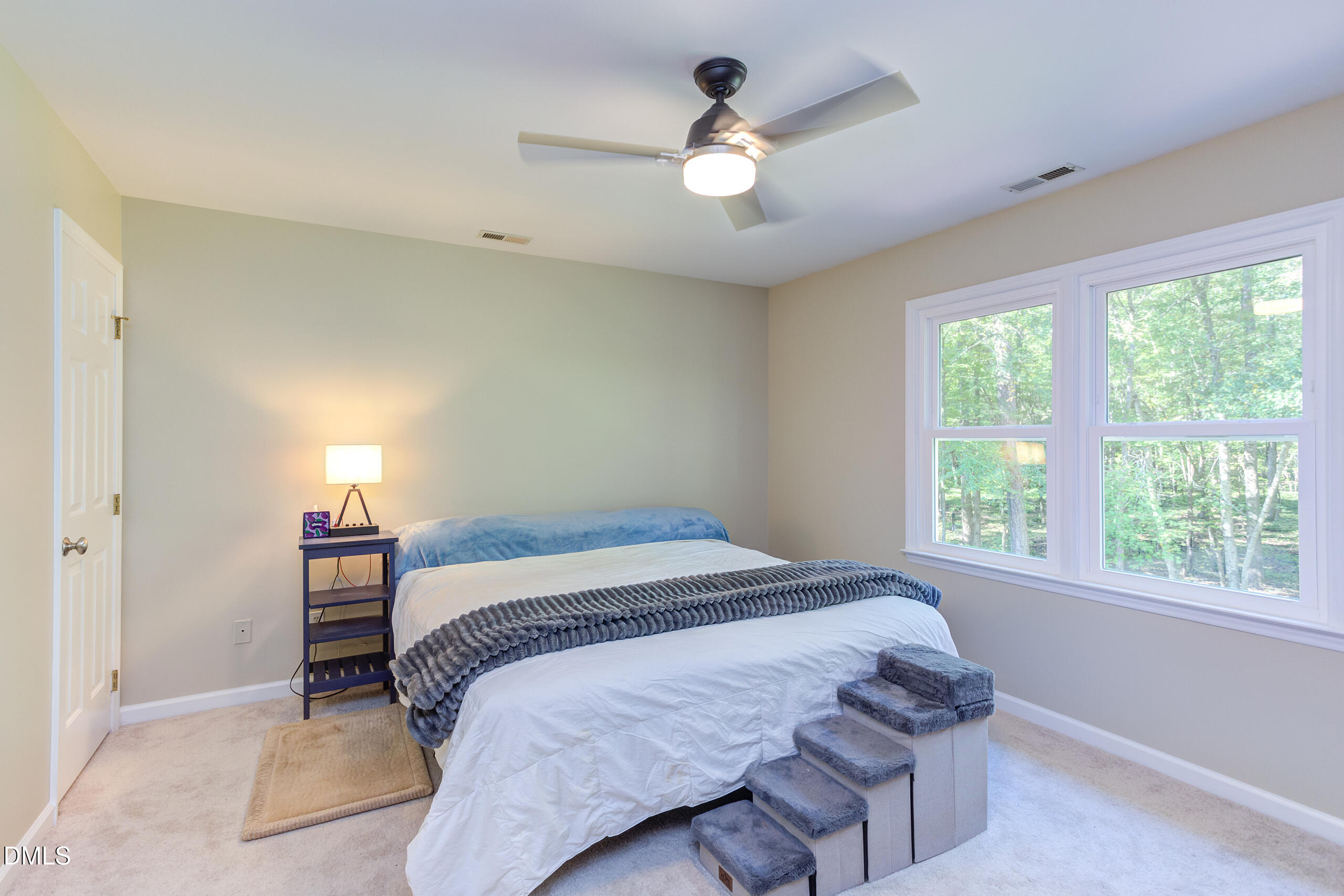 2120 New Sharon Church Road Hillsborough, NC 27278 - Photo 24 of 51 a bedroom with a large bed and a chandelier