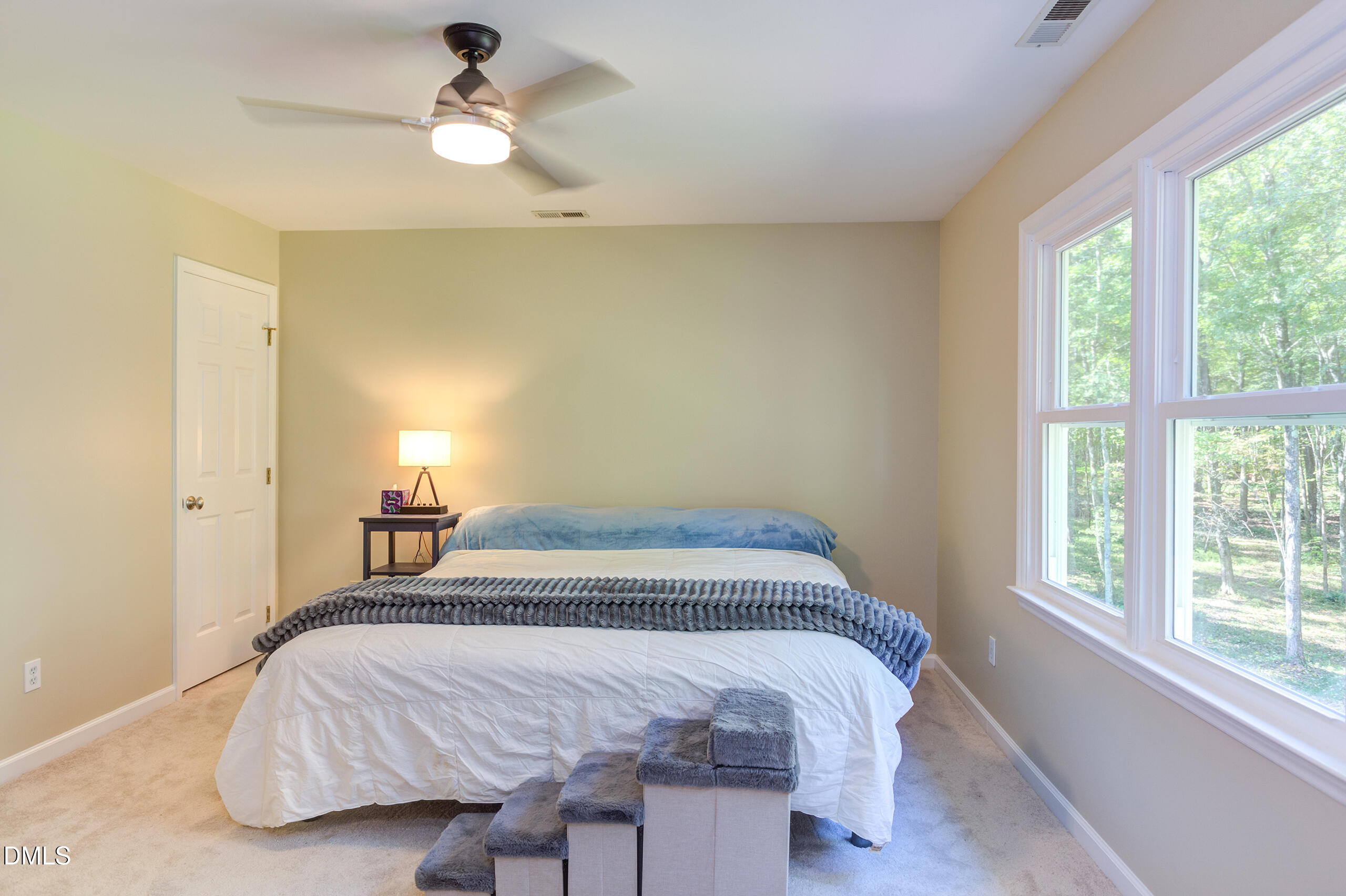 2120 New Sharon Church Road Hillsborough, NC 27278 - Photo 25 of 51 a bedroom with a bed and a chandelier