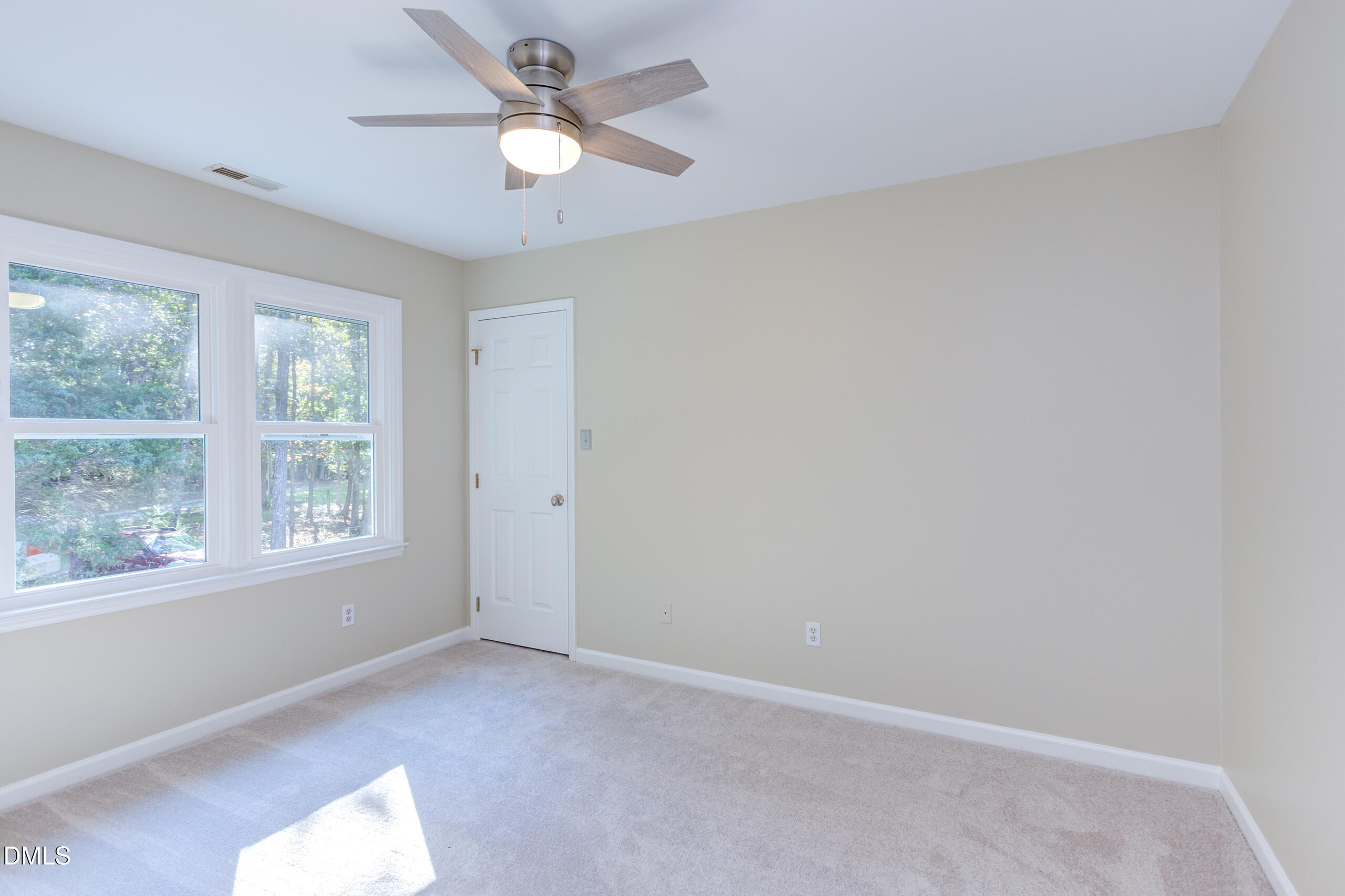 2120 New Sharon Church Road Hillsborough, NC 27278 - Photo 28 of 51 an empty room with a window and a fan